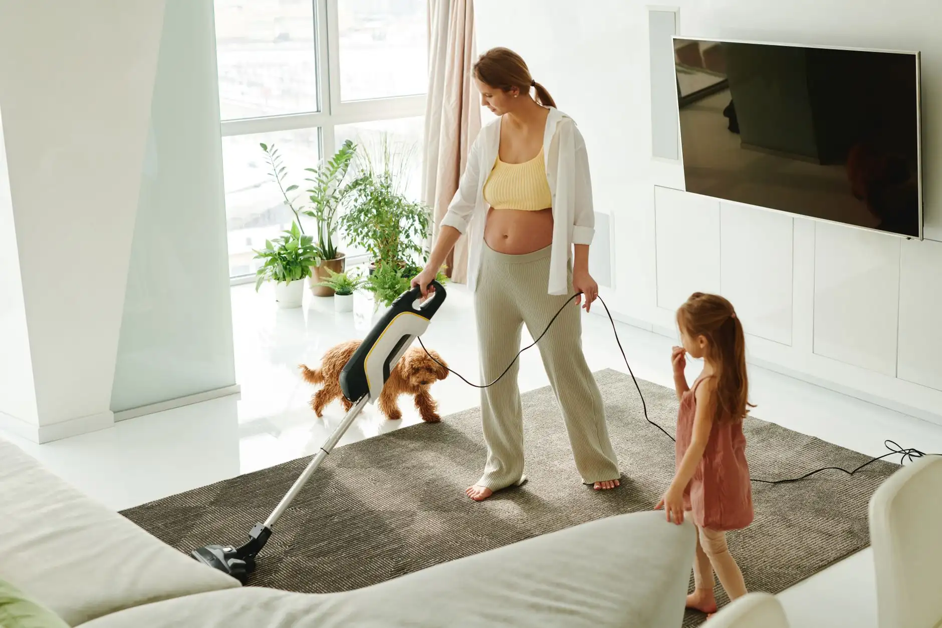 Family living room being vacuumed